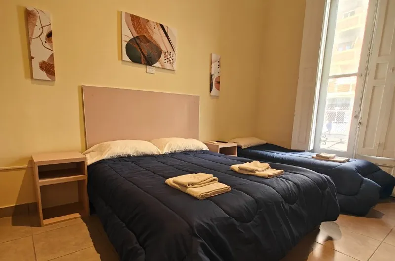 Departamento con cama matrimonial y cama simple en Apart Hotel Belgrano